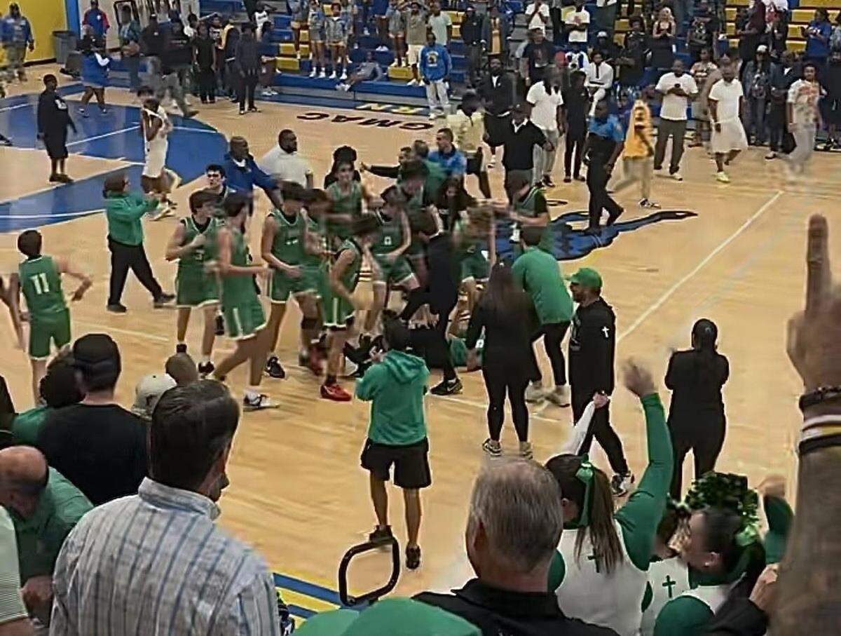 The St. Brendan boys’ basketball team celebrates a Region 4-4A semifinal win over top seeded Miami Northwestern 70-69.