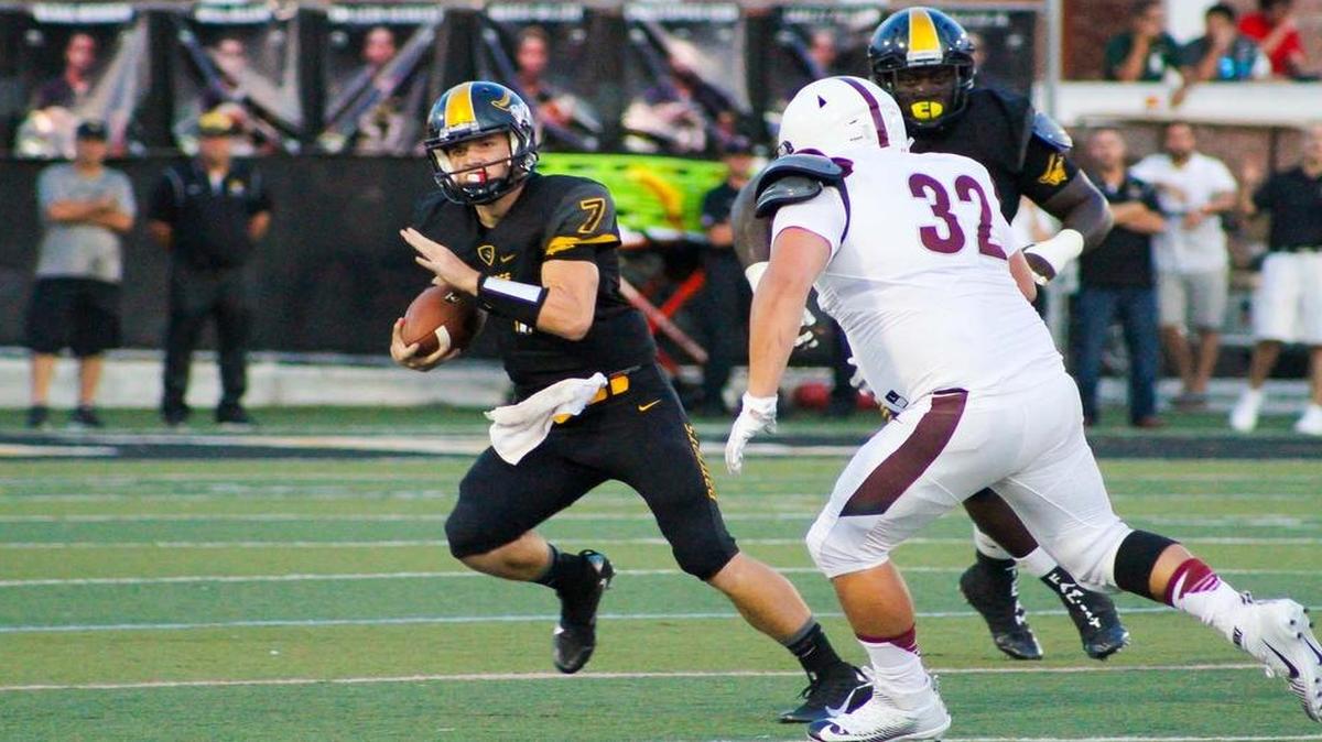 American Heritage quarterback Jason Brown takes off on a run during Friday night’s big victory over nationally ranked Don Bosco Prep of Ramsey, New Jersey.