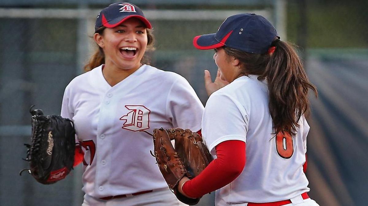 Doral's pitcher #6 Kassandra Machado is congratulated as she runs off the field by #27 Kaitlyn Perez as Doral Academy hosts Pines Charter in softball on Tues., May 9, 2017.
