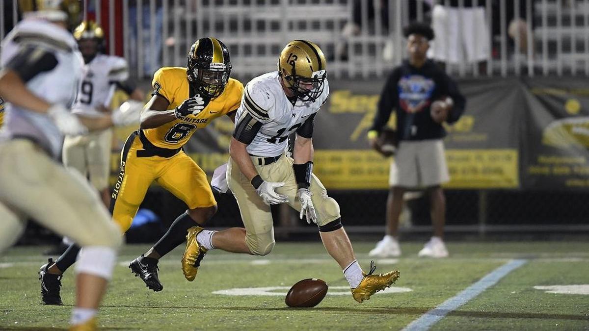 Bishop Moore receiver Jake Kiefer drops the ball in front of American Heritage defensive back Tyson Campbell during the first half of their game on Friday, Nov. 17, 2017. Heritage won.