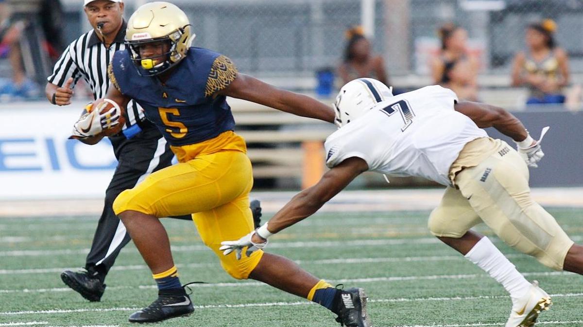 St. Thomas Aquinas Riders running back Daniel Carter (5) carries the ball against St. John Bosco during their football game on Friday, Aug. 25, 2017 at St. Thomas Aquinas High School in Fort Lauderdale.