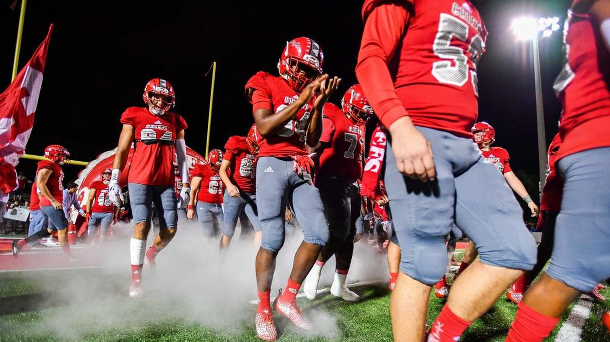 Cardinal Gibbons football team game makes their way onto the field during their home game against Tampa Bay Jesuits in Fort Lauderdale on Friday night, November 30, 2018. Cardinal Gibbons won 14-3.