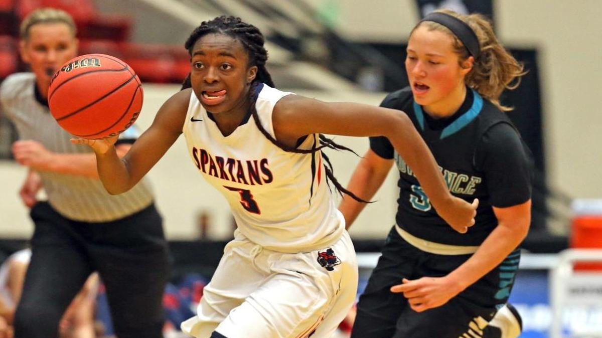 Miami Country Day Channise Lewis, 3, takes the ball down court as they play Providence HS in the 4A Championship at the Florida High School State Championships in Lakeland, Fl, Feb. 24, 2017.