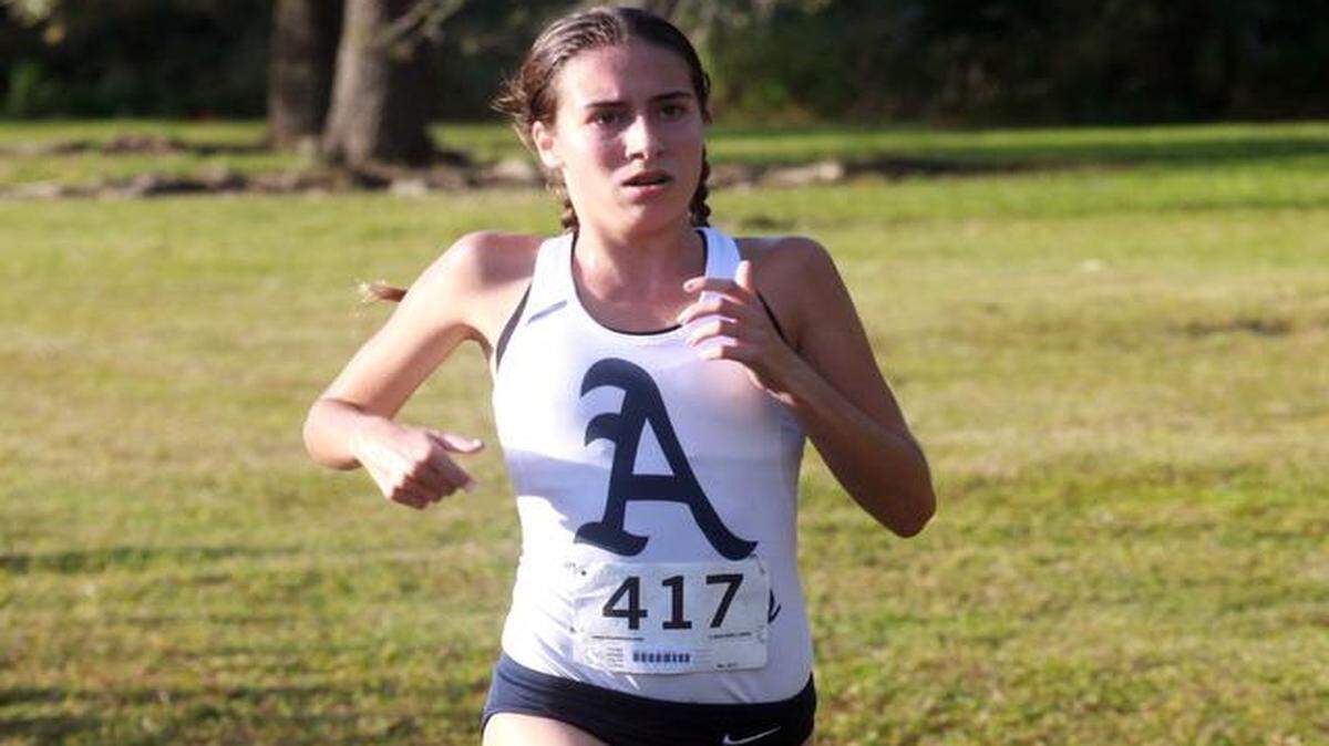 
Girls champ: Alexa Cruz of St. Thomas Aquinas won the girls Region 4-4A cross-country title. 
