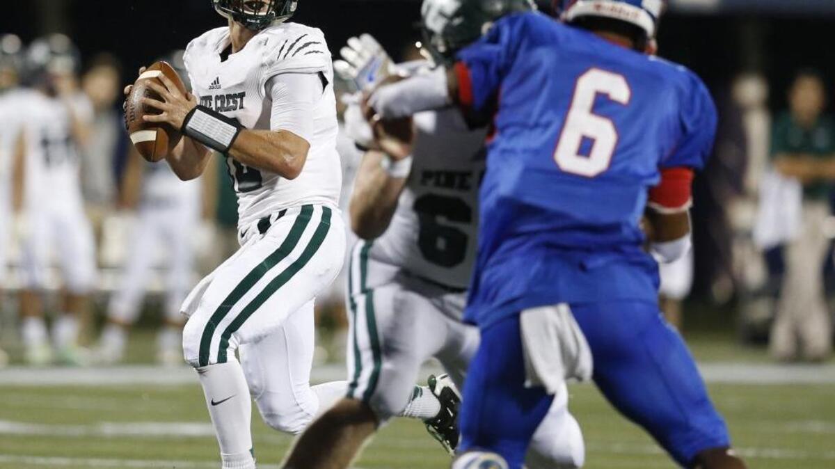 Pine Crest quarterback Jordan Schulefand sets up to pass during Saturday night’s game against King’s Academy.