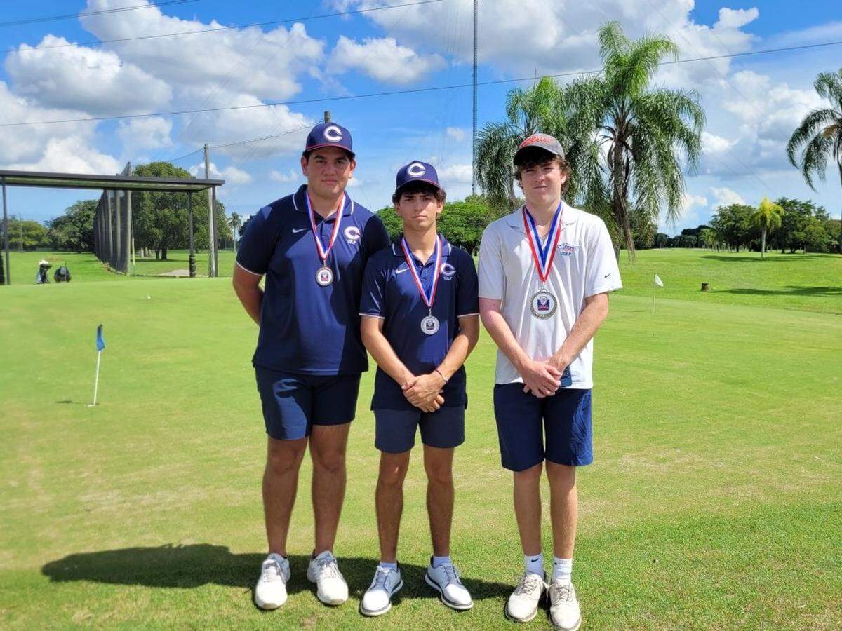 At the GMAC Golf Tournament, (from left) Nicholas Shortal of team champ Columbus was third; Joseph Fernandez of team champ Columbus was second; and Alfonso Goyeneche of runner-up MAST was first.