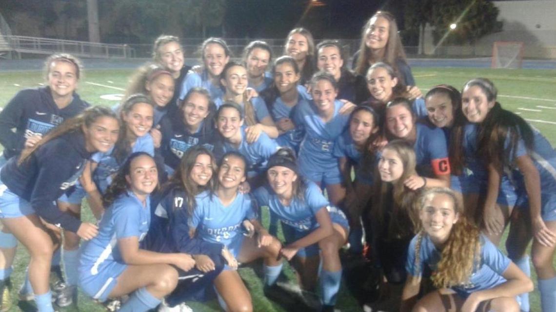Members of the Lourdes Academy girls’ soccer team celebrate their victory over Boca Raton High on Friday. The Bobcats are headed to the Class 5A state final for the second time in the past three seasons.