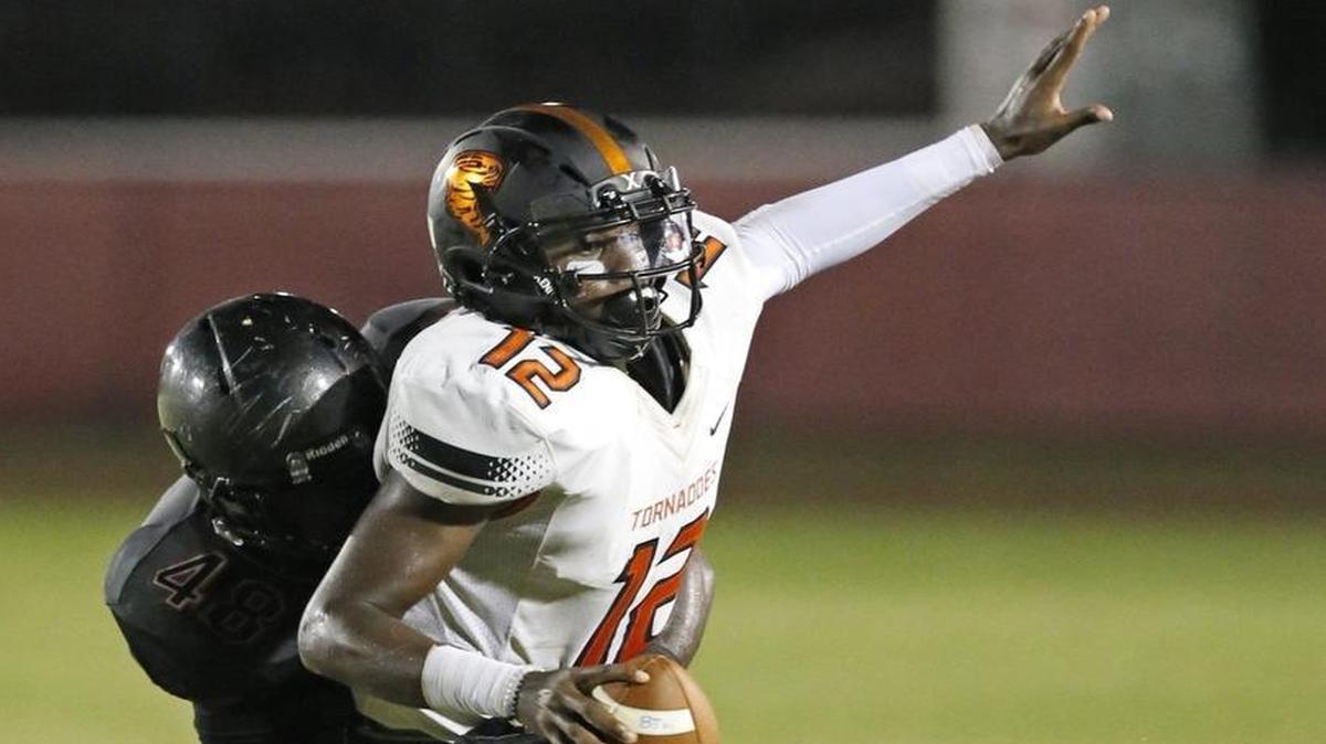 Booker T's Daniel Richardson is sacked by as Southridge's Dimitri Prophete.