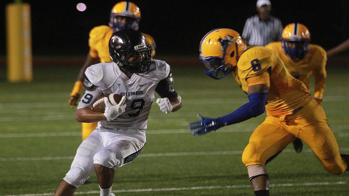 Orlando Hidalgo Jr. of Columbus runs for yards in their game against Northwestern at Traz Powell Stadium on Friday, September 4, 2015.