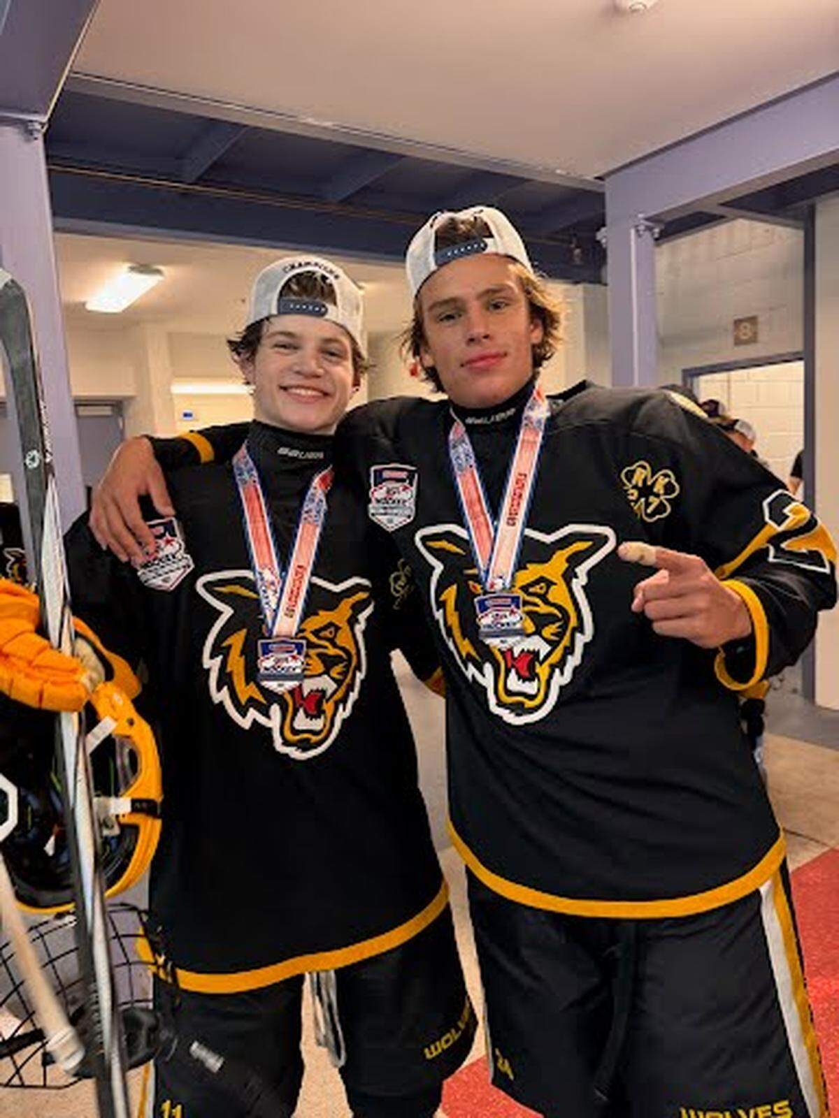 Cristian Paz (Columbus) and Juan Sebastian Ibarra (Gulliver Prep) are two members from Miami on the Golden Wolves 16U national championship ice hockey team.