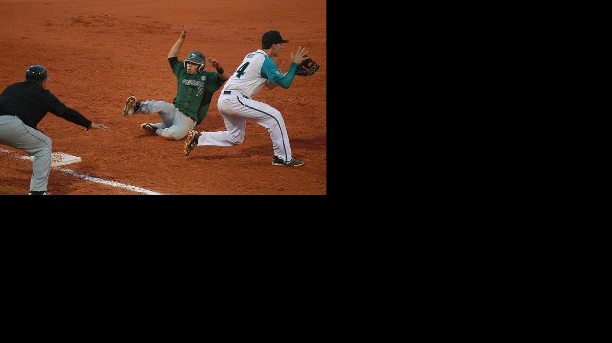 
Eric Rivera, of Flanagan High slides safely into third base against Archbishop McCarthy High, Friday, April 10, 2015.
