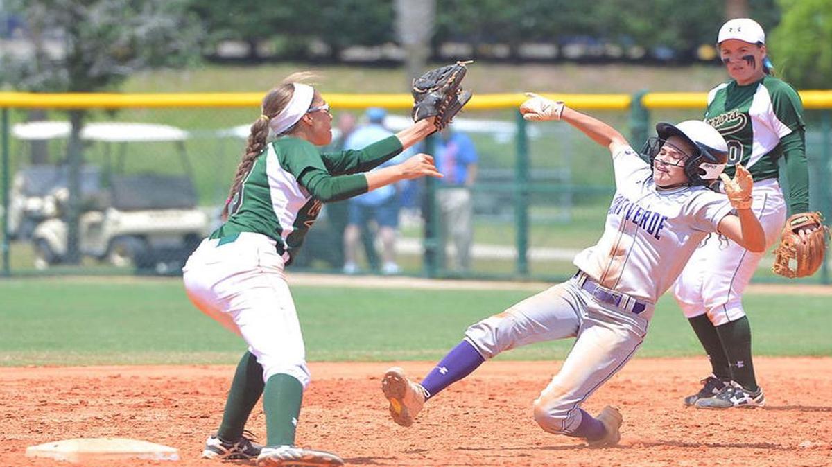 Westminster Christian shortstop Ally Mena, left, tries to make a play at second base as Montverde Academy’s Natalia Rodriguez slides in while Westminster second baseman Adriana Otero looks on during the Class 4A state semifinal at Dodgertown on Thursday.
