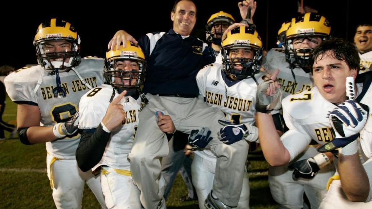 Belen players give a victory ride to coach Rich Stuart Dec. 11, 2009 after defeating Lake Wales to reach the 3A state football tournament. - THE