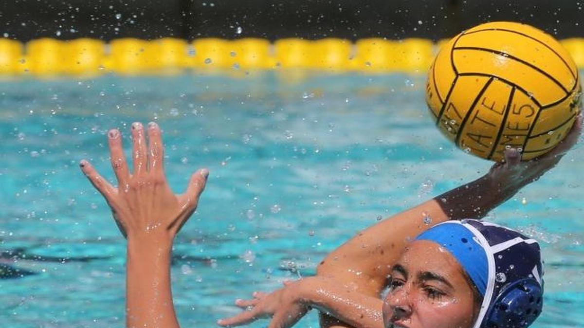 Gulliver Prep Alissa Pascual tries to shoot the ball as Olympia HS Leila Sorrells 12, and Julie Marcus 3, defends at the FHSSA Finals Girl's Water Polo State Championships Saturday, April 8, 2017, in Miami.