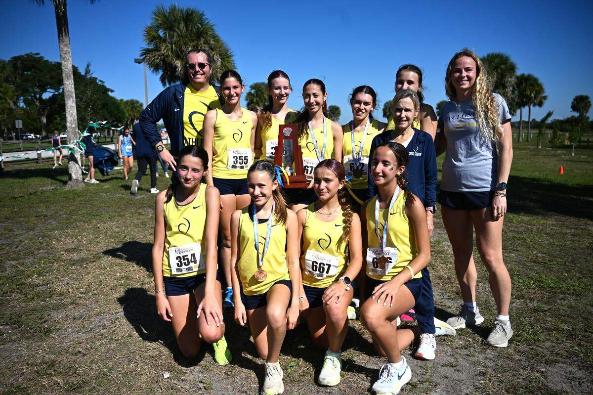 The region champion Carrollton girls’ cross-country team.