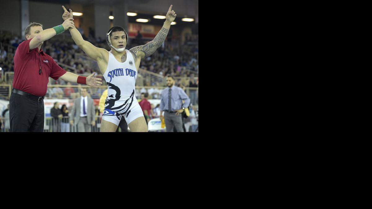 
Pat Lugo of South Dade celebrates after defeating Giovanny Bonilla of Osceola Kissimmee during the finals of the FHSAA State Wrestling Championships in Kissimmee, Fla., Saturday, March 14, 2015. 
