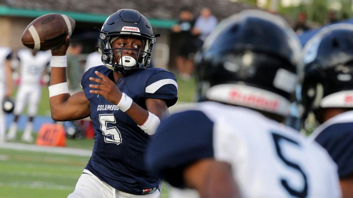 Columbus’s quarterback Brandon McDuffey, looks to pass over Palmetto players during the first quarter of the Columbus Explores Varsity Football vs Miami Palmetto Varsity football game at Tropical Park on Thursday, November 15, 2018. Columbus won 42-0.