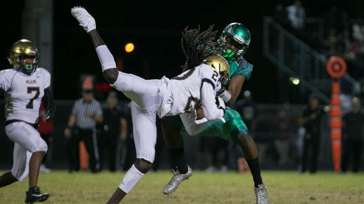 Miami Stingarees’ John Crawford (20) intercepts a pass in the end zone intended for the Atlantic Eagles Cadarius Gaskin on Friday.