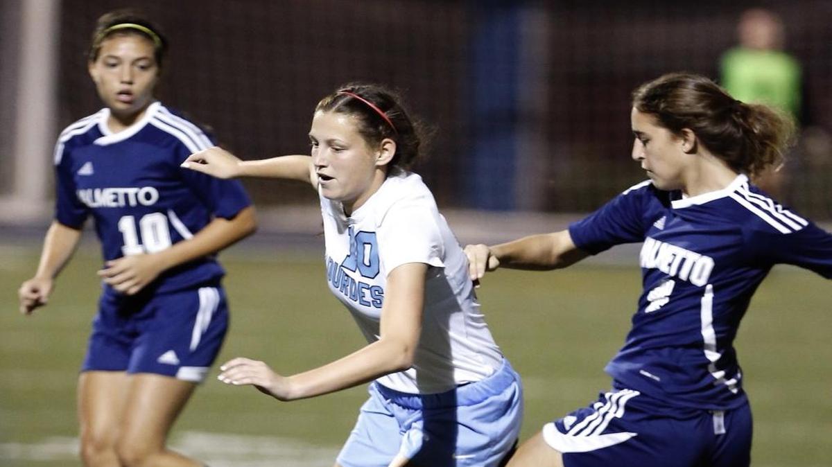 The Palmetto girls’ soccer team is shown during a game against Lourdes last season.