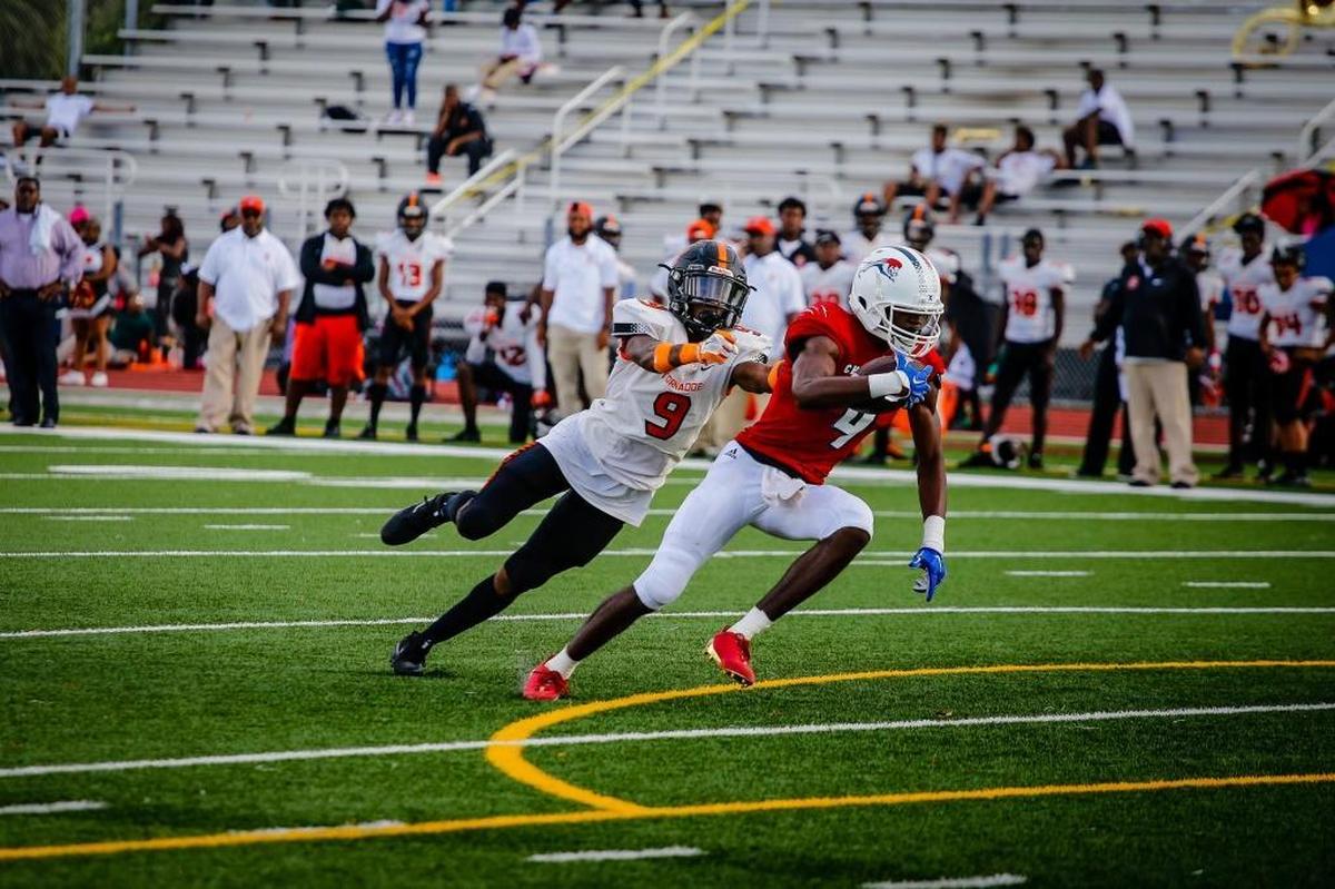 Chaminade player Marvin Alexander runs the ball during a game between Booker T. Washington and Chaminade-Madonna College Preparatory School at Chaminade-Madonna College Preparatory School in Hollywood, Fla.