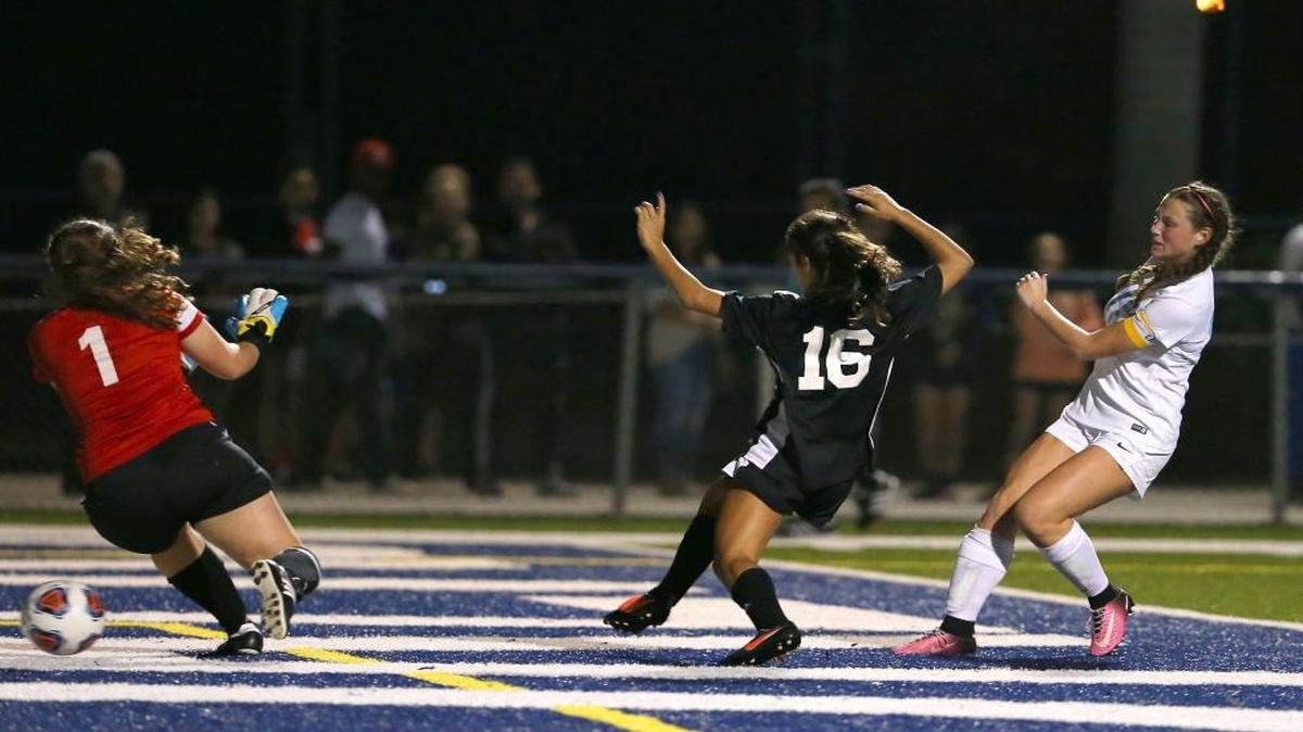 Lourdes Academy midfielder Natalie Silberman (10) scores a goal during second half of the girls soccer regional quarterfinal against Coral Reef at Christopher Columbus High School field on Thurs., Jan. 26, 2017 in Miami.