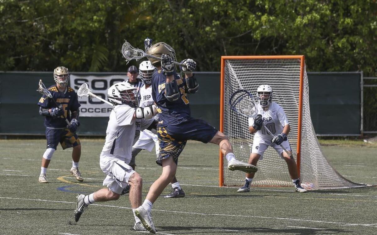 St. Thomas Aquinas' Chris Stefans (25) shoots the ball while Gulliver Prep's Lucas Rego (10) blocks during the fourth quarter of a third round play-in game on Saturday, April 23, 2016 at Gulliver Prep.