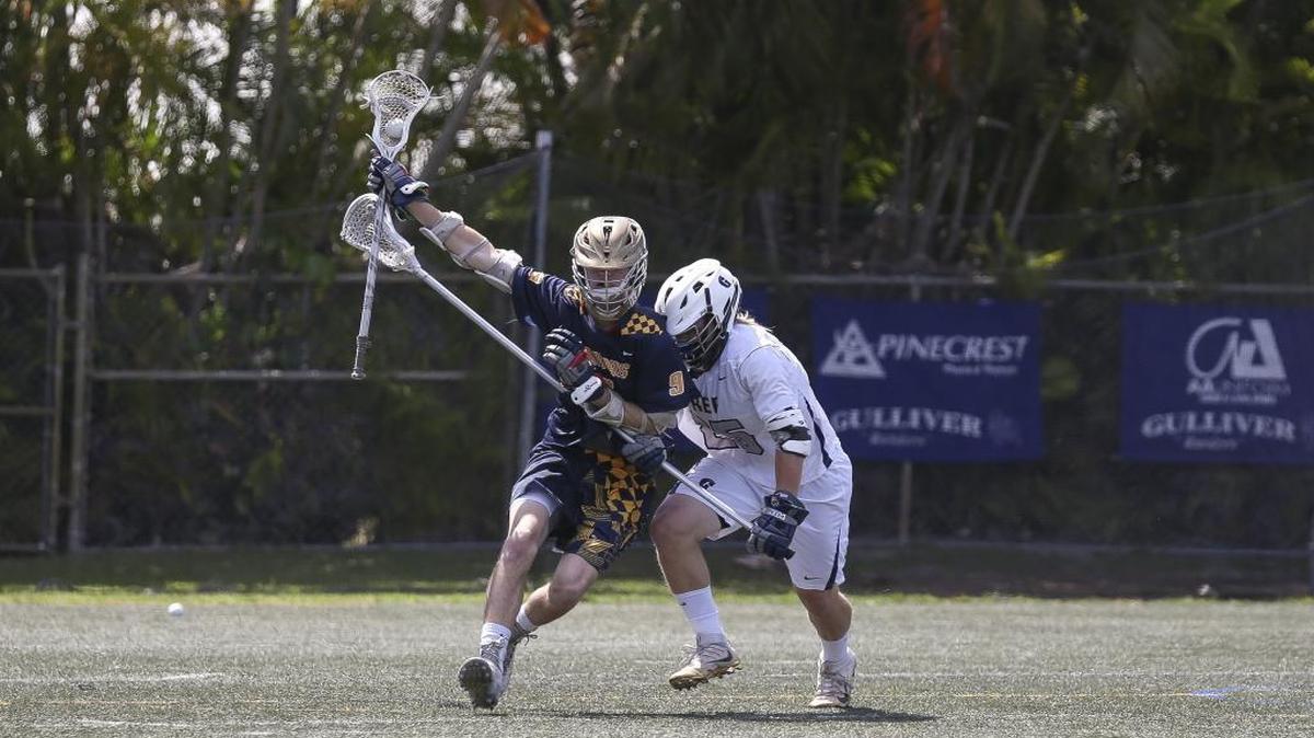 St. Thomas Aquinas' Kevin Crowley (9) tries to gain control of the ball while Gulliver Prep's Chris Stefans (25) defends during the first quarter of a third round play-in game on Saturday, April 23, 2016 at Gulliver Prep.