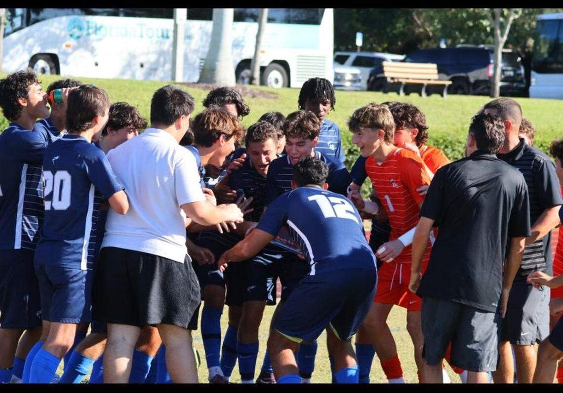 The NSU University School boys’ soccer team celebrates winning the Palm League Championship.