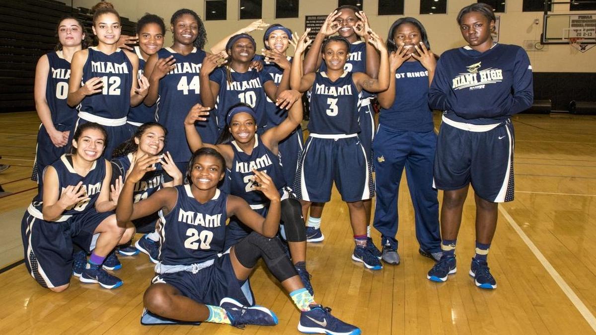 The Miami High girls’ basketball team celebrates Friday, Jan. 22, 2016 after beating Ferguson for its fourth consecutive GMAC championship.
