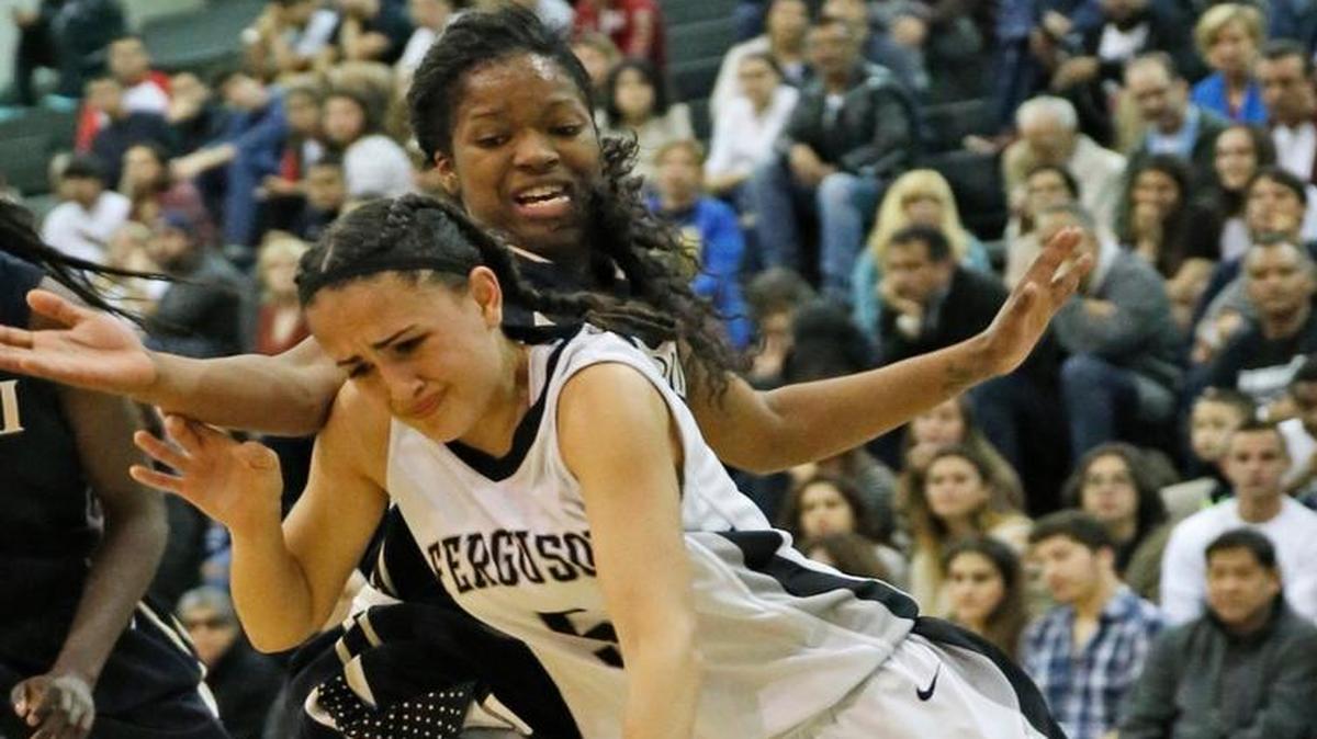Ferguson High’s Gio Perez is defended by Miami High’s Armani Paschal during a game last season. The teams will meet for the second consecutive season in the GMAC final at 7 p.m. Friday at Ferguson.