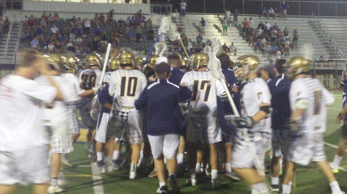
Not finished yet: The St. Thomas Aquinas boys’ lacrosse team celebrates  Saturday’s win, which puts it in its second consecutive state final four.
