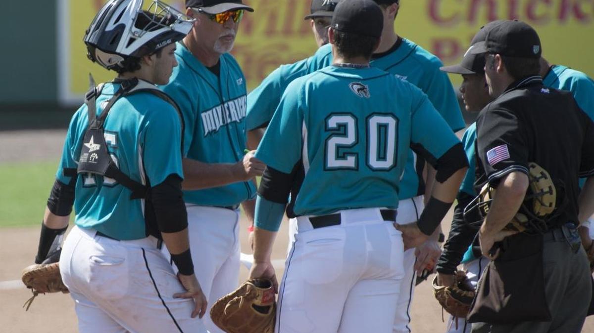 Archbishop McCarthy coach Rich Bielski huddles with players during last year’s Class 5A state championship game in Fort Myers.