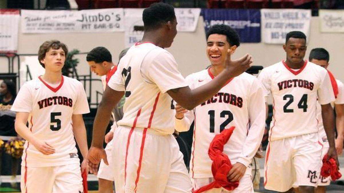 
Miami Christian’s Joseph Allen and Anthony Fernandez celebrate after winning the Class 2A state title against Orlando Agape Christian on Wednesday, Feb. 24, 2015 in Lakeland, Fla. 
