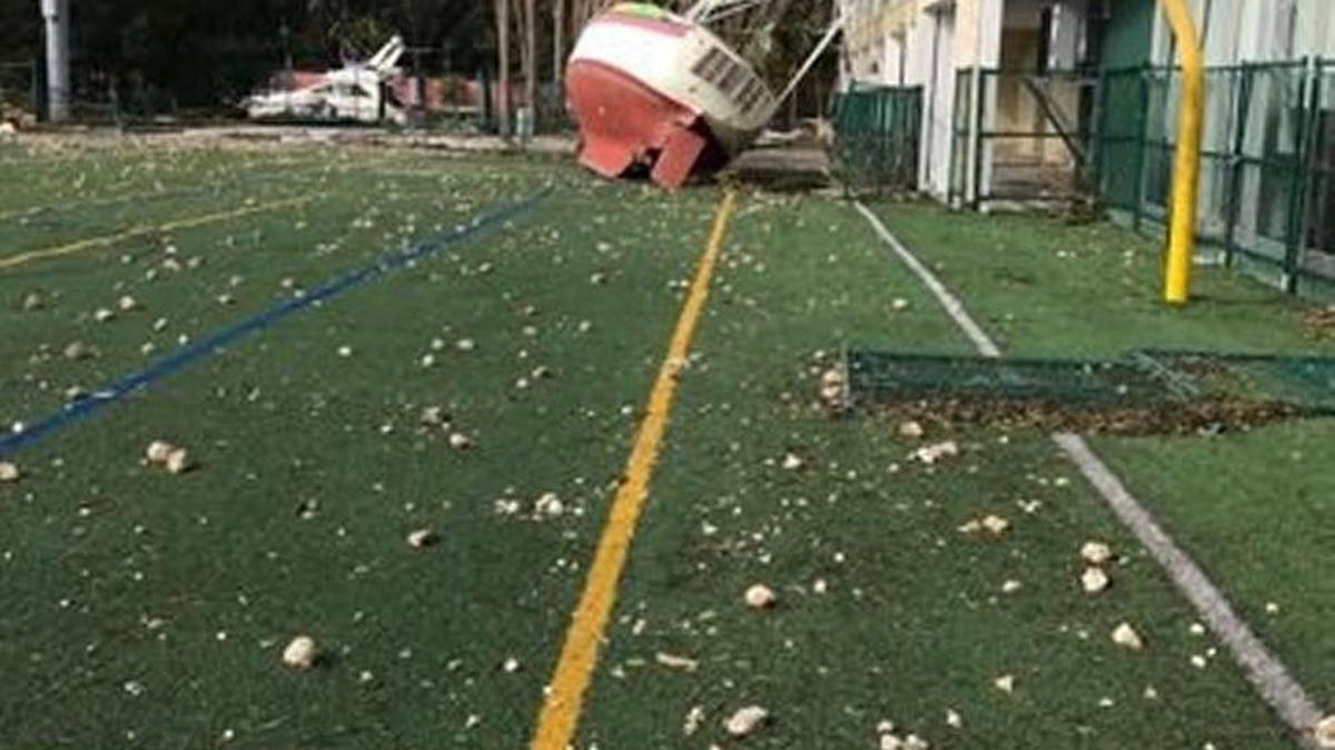 The Ransom Everglades football Twitter page posted these photos Tuesday of its home field (located off the waters of Biscayne Bay), which was devastated by storm surge from Hurricane Irma and had multiple boats wash up on to the campus.