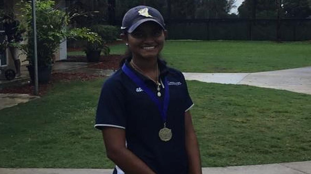 Tanya Eathakotti of Carrollton poses Wednesday after winning her first Youth Fair golf championship at Country Club of Miami.