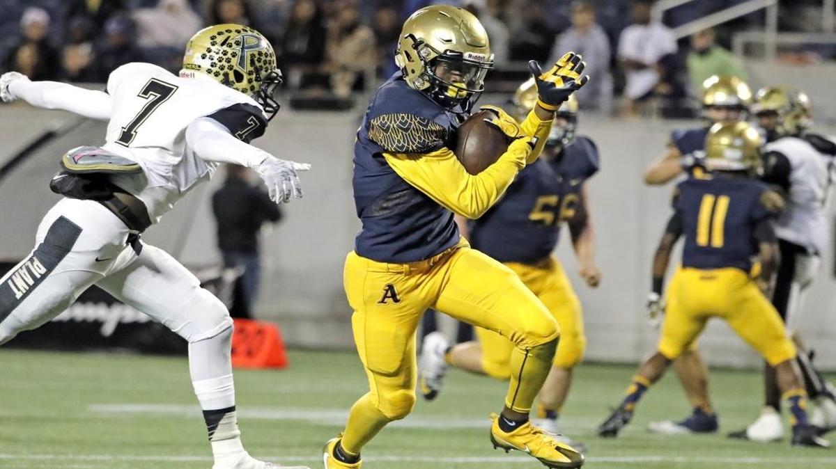 Aquinas wide receiver Michael Harley (3) scores in the third quarter as St. Thomas Aquinas plays Tampa Plant for the Class 7A state football title at Camping World Stadium in Orlando on Fri., Dec. 9, 2016.