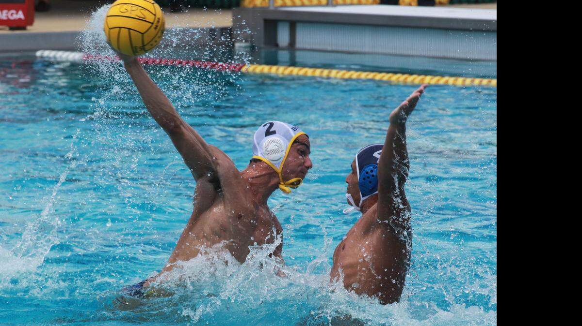 
Ryan Guso of Belen takes a shot at Gulliver’s goal as Alex Fuwee defends Saturday, April 11, 2015.

