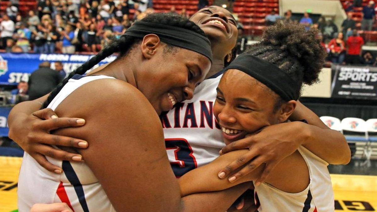 Miami Country Day Aasiya Berry, Channise Lewis, and Sydney Shaw celebrate winning over Providence HS in the 4A Championship at the Florida High School State Championships in Lakeland, Fl, Feb. 24, 2017.