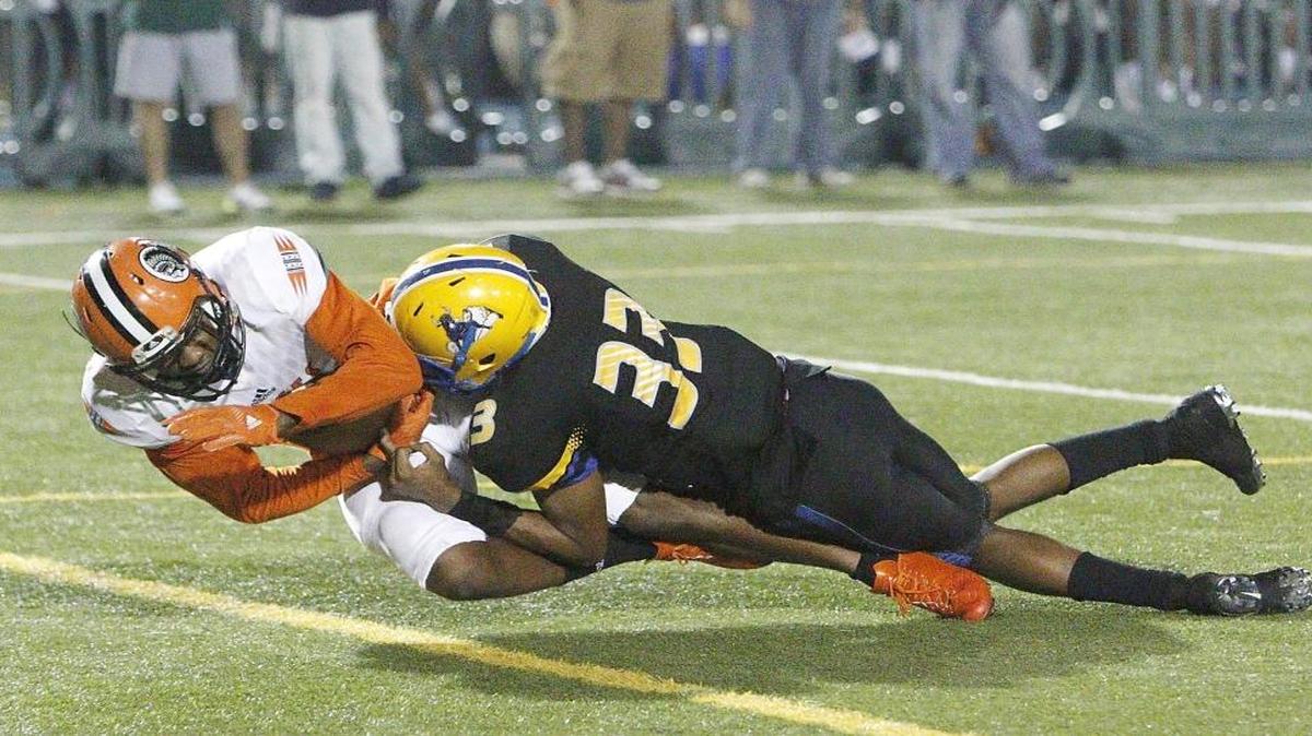 Carol City Chiefs wide receiver Kevaughn Dingle (1) scores a touchdown against Northwestern Bulls during the football game on Fri., Nov. 18, 2016 at Traz Powell Stadium in Miami.