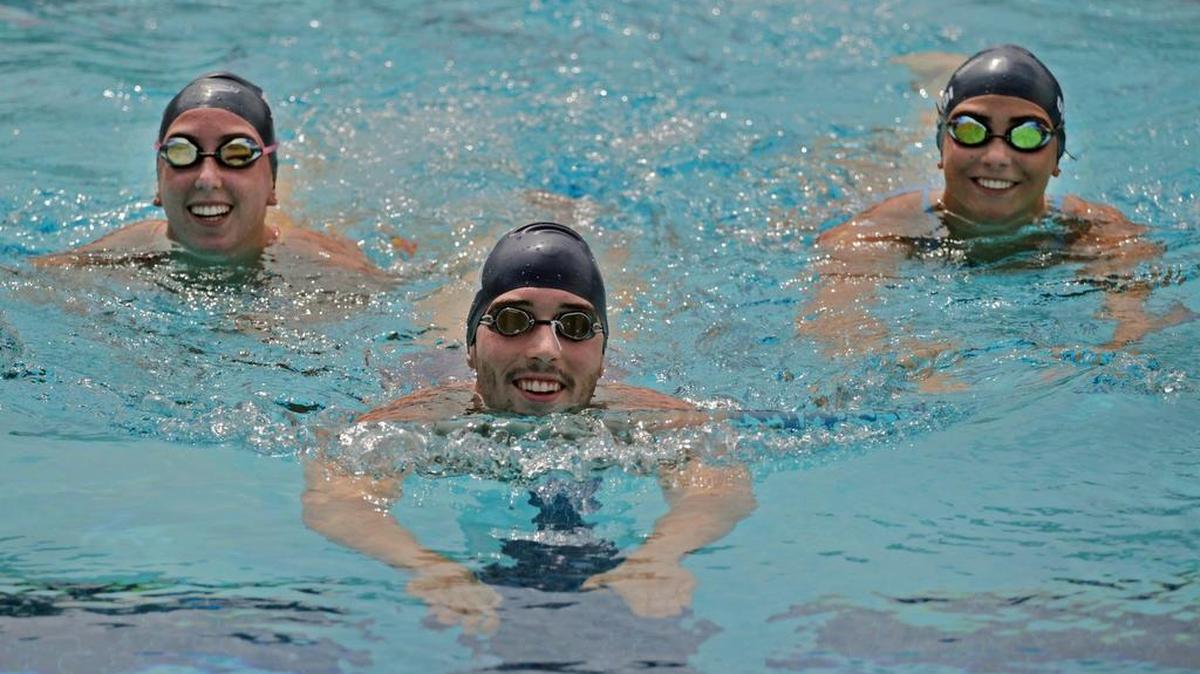 
Olympic hopeful swimmers Kelly Fertel, 17, left, Nick Carter, 25, and Niki Urquidi, 17, at the Gulliver Preparatory School Aquatic Center.
