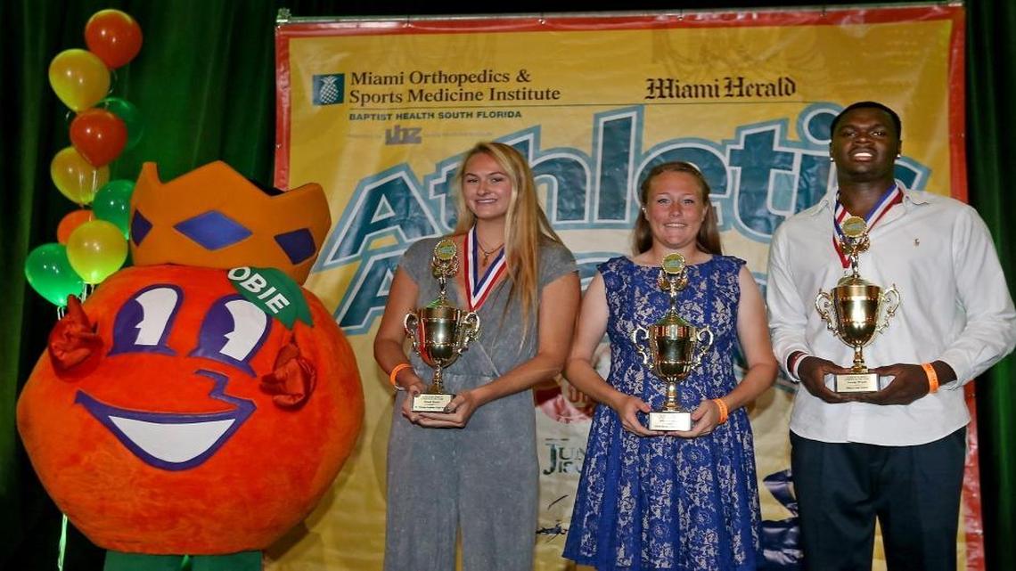 Athlete's of the Year St. Thomas Aquinas' Brook Bauer (left), Coral Springs Charter's Allison Muraskin and Dillard's Jordan Wright receive their trophies at the Miami Herald Broward Athletic Awards banquet at the Signature Grand in Davie on Thurs., May 25, 2017.