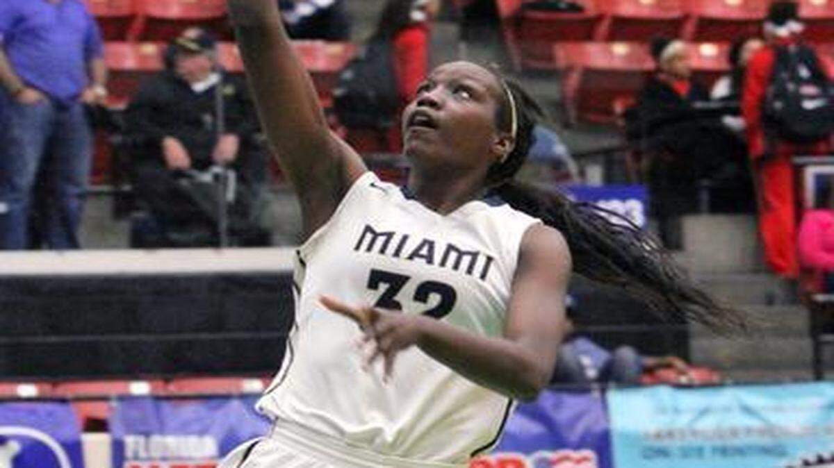 
Miami High center Beatrice Mompremier, who finished with 21 points, 21 rebounds and 8 blocks, scores easily against Boca Raton during an FHSAA girls’ basketball Class 8A semifinal game at The Lakeland Center on Friday, Feb. 20, 2015. 
