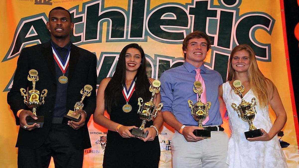 All-Dade Athletes of the Year, from left, Dewan Huell of Norland, Michelle Cuervo of Ferguson, and Michael Colonna and Sofia Carrera-Justiz, both of Ransom Everglades.