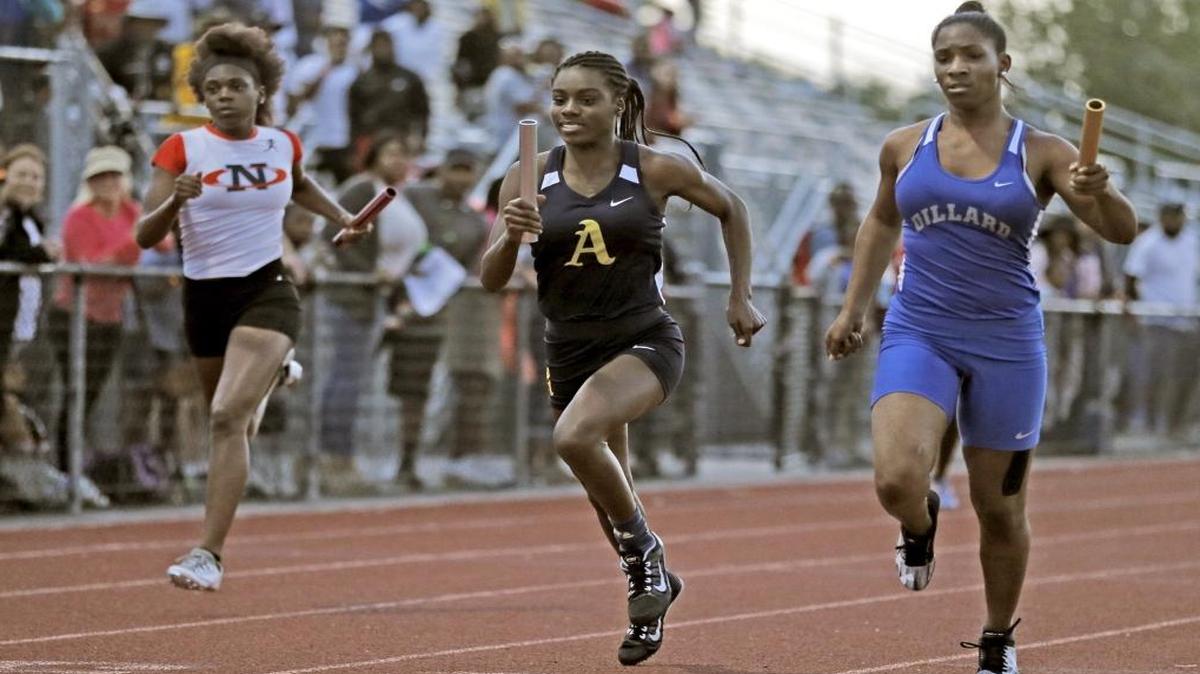 At the finish of the Girls 4x100 Meter Relay during the Broward County Athletic Association Track & Field Championship at Dillard high School on Fri., March 24, 2017.