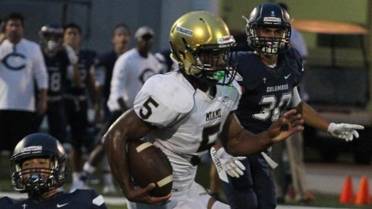 Columbus’ Lucas Medina misses a tackle as Miami High’s Johnny Ford sprints to the end zone for a touchdown after a kick return on Thurs., Sept. 28, 2017 at Columbus. The Explorers won 21-20.