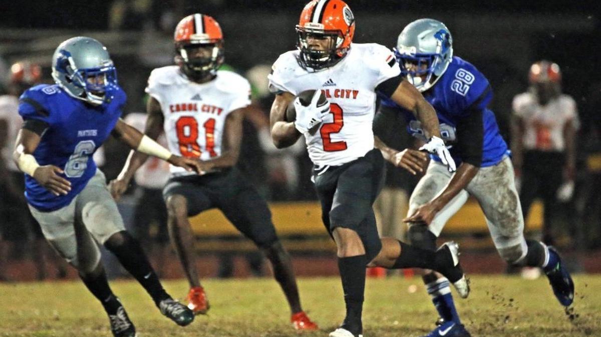 Carol City’s Camron Davis (2) runs for a first-quarter touchdown as they play Dillard in Fort Lauderdale last season. On Friday, the best of the best will face in the Dade vs. Broward All-Star Game.