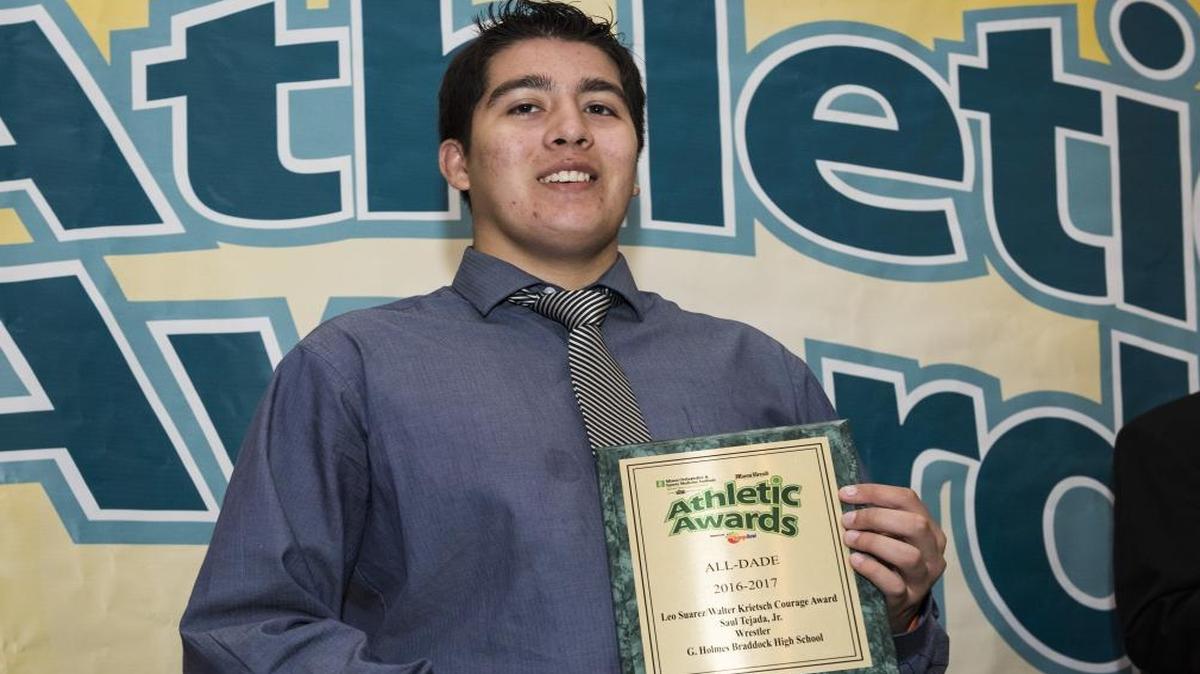 Braddock wrestler Saul Tejada Jr. is honored with the Leo Suarez/Walter Krietsch Courage Award at the Miami Herald Miami-Dade Student Athletic Awards Ceremony on Tues., May 23, 2017.