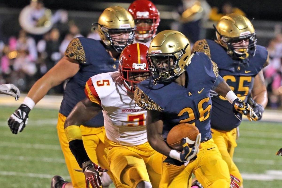 Saint Thomas Aquinas HS Nigel White runs the ball tin the second quarter as they play Deerfield Beach HS at Saint Thomas Aquinas HS, Oct. 6, 2017.