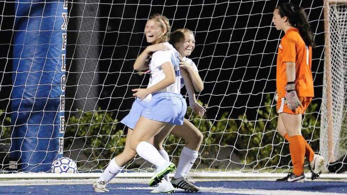 
On their way: Olivia Perez, left, celebrates with teammate Sofia Portuondo, center, after scoring. 
