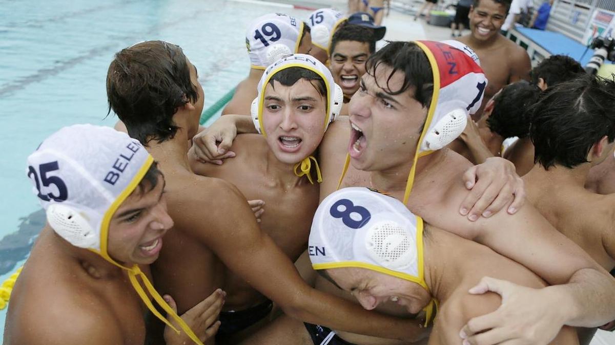 The Belen Jesuit boys’ water polo team celebrates after defeating St. Thomas Aquinas at Ransom Everglades on Saturday for its second state championship in a row.
